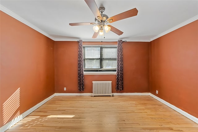 unfurnished room featuring crown molding, radiator heating unit, ceiling fan, and light wood-type flooring