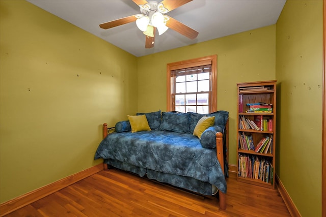 bedroom featuring hardwood / wood-style floors and ceiling fan