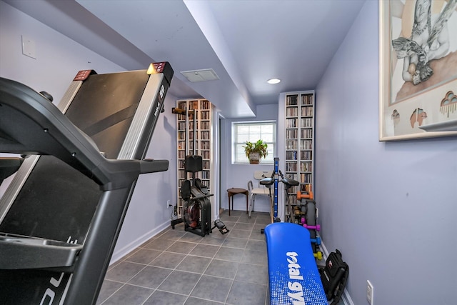 workout area featuring tile patterned floors