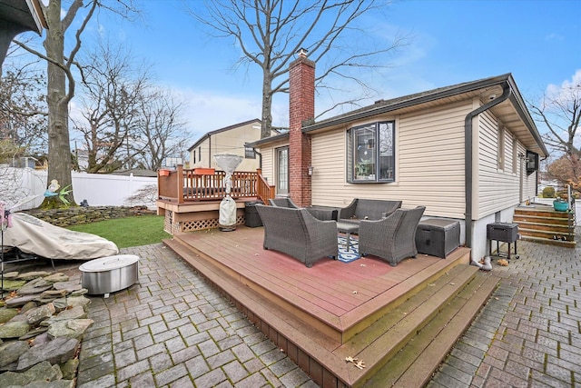 wooden deck featuring a patio and an outdoor hangout area