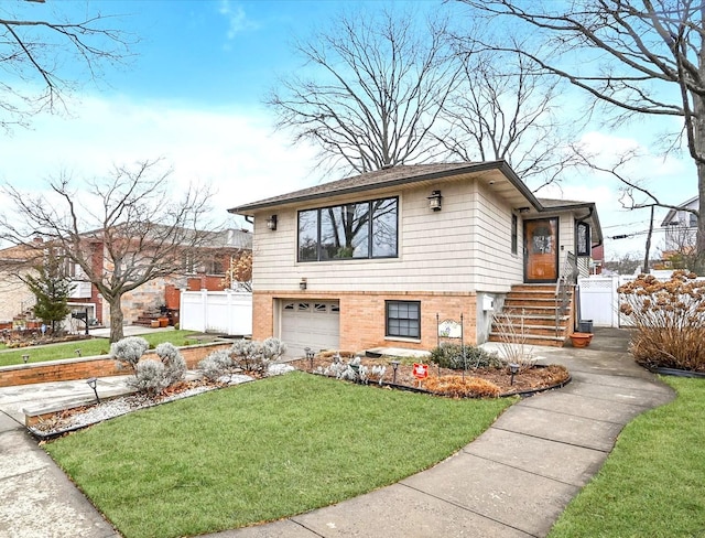 view of front of house featuring a garage and a front yard