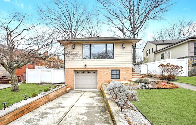 view of front facade with a garage and a front yard