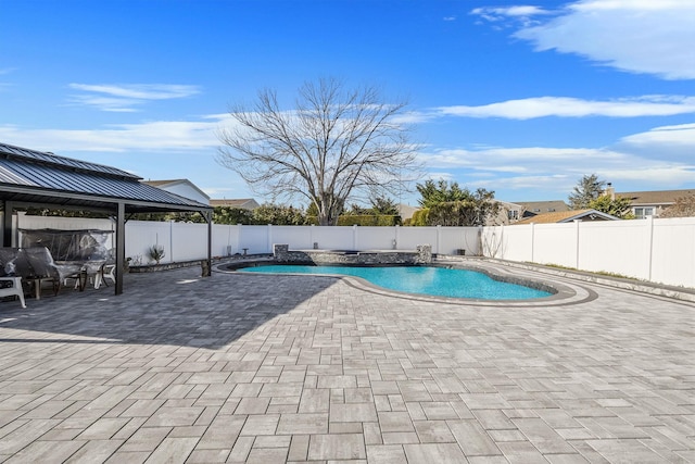 view of swimming pool featuring a gazebo and a patio area