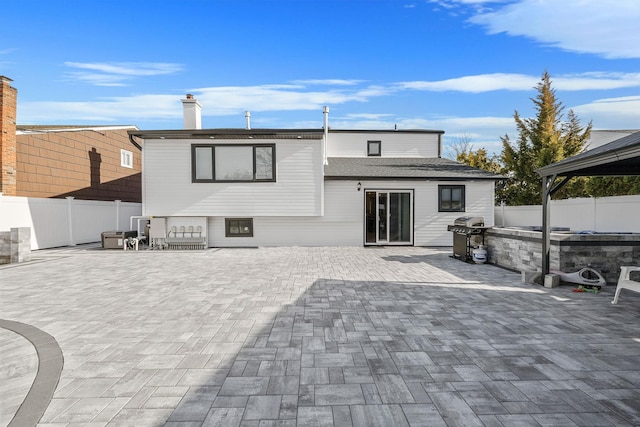 rear view of house featuring a patio area