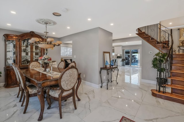 dining room with a notable chandelier