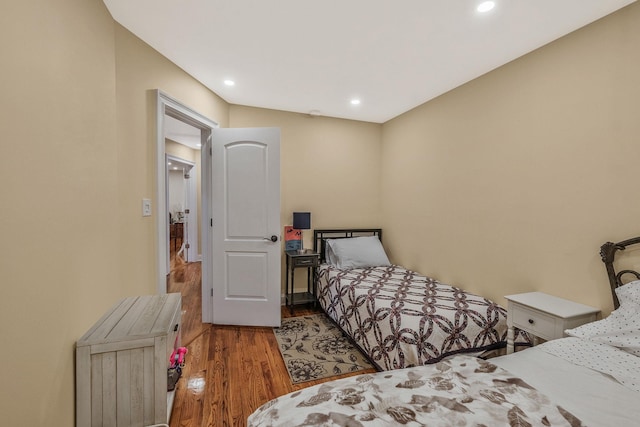 bedroom with hardwood / wood-style flooring