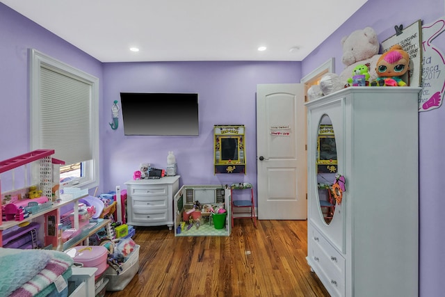 rec room with dark wood-type flooring