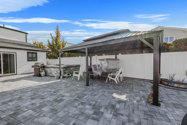 view of patio featuring a gazebo and a grill