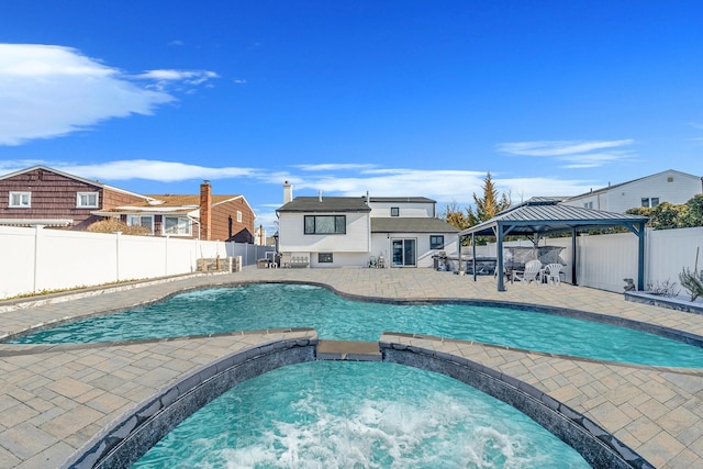 view of swimming pool with a gazebo and a patio