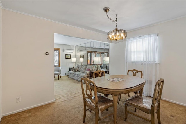 dining space with an inviting chandelier, a wall unit AC, ornamental molding, and carpet