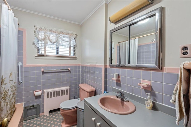 full bathroom featuring radiator, crown molding, tile walls, vanity, and tile patterned floors