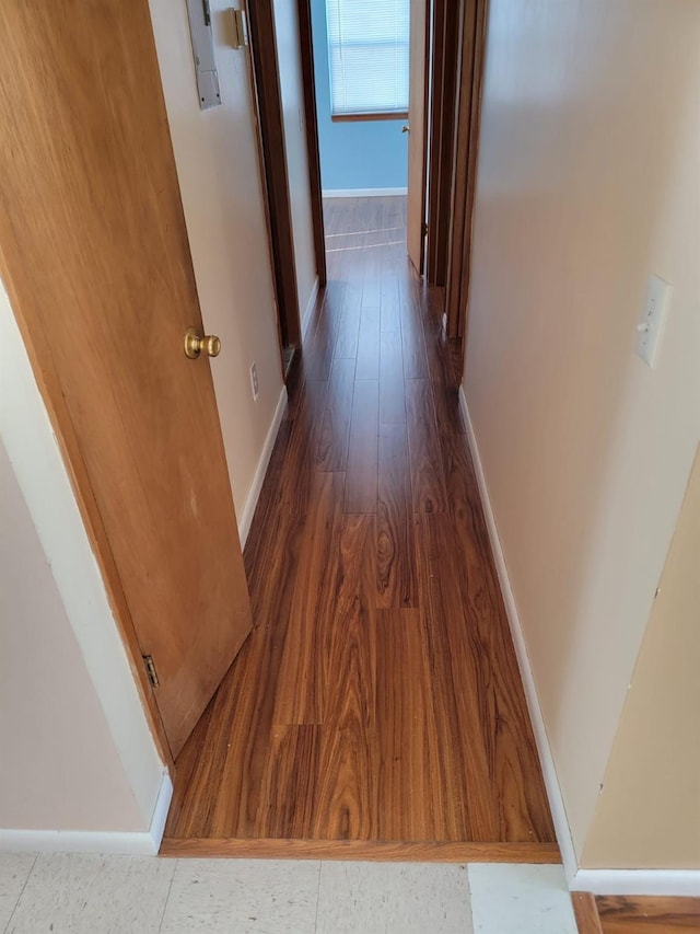 corridor featuring dark hardwood / wood-style floors