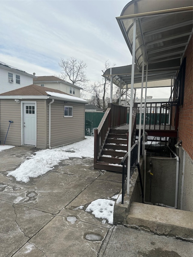 view of patio with a storage shed