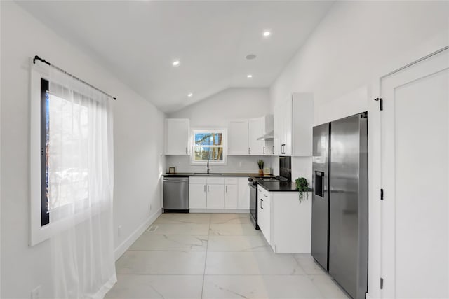 kitchen featuring dark countertops, marble finish floor, white cabinetry, and stainless steel appliances