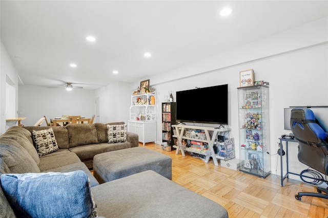 living room with ceiling fan and light parquet floors