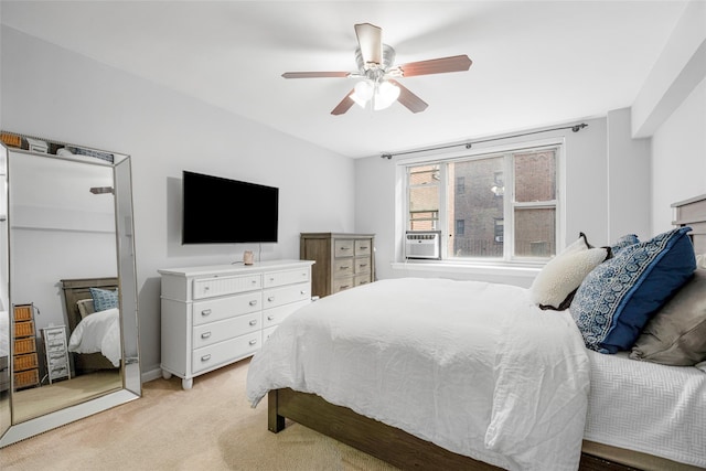 bedroom featuring light carpet, cooling unit, and ceiling fan