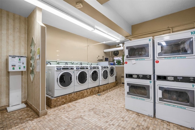 clothes washing area featuring separate washer and dryer and stacked washer / dryer