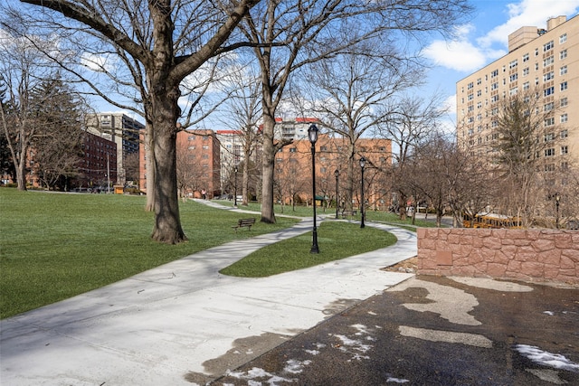 view of home's community featuring a lawn