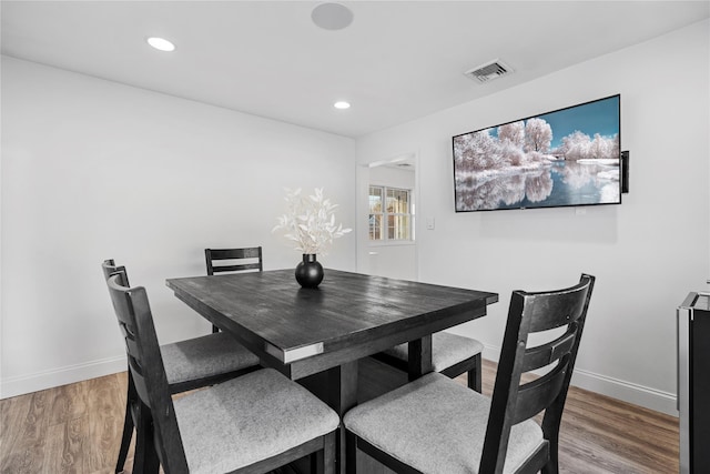 dining area featuring hardwood / wood-style floors