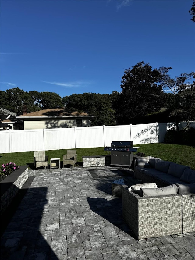 view of patio / terrace with an outdoor living space and a grill