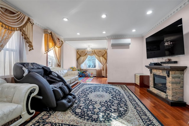 living room featuring recessed lighting, a fireplace, wood finished floors, ornamental molding, and a wall mounted AC