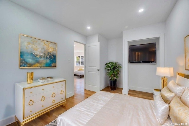 bedroom with light wood-type flooring