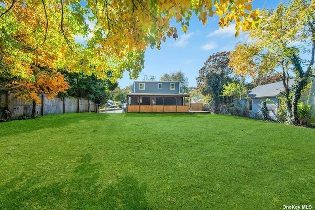 view of yard with a sunroom