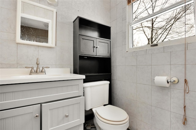 4 Young Rd, Coram, NY 11727 - bathroom featuring vanity, toilet, and tile walls