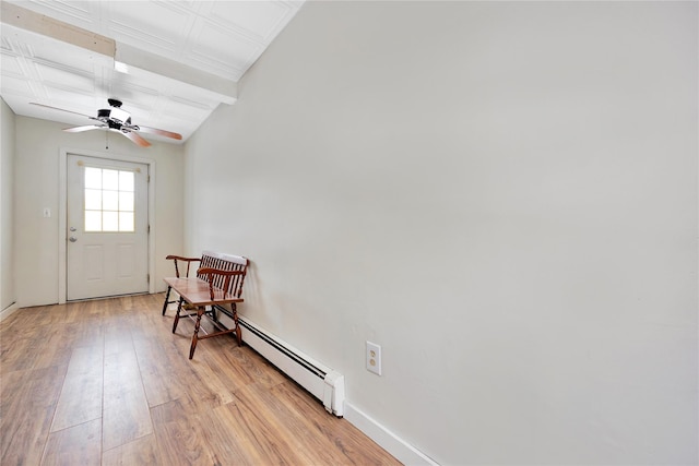 4 Young Rd, Coram, NY 11727 - doorway with baseboard heating, baseboards, a ceiling fan, and light wood-style flooring