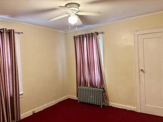 221-14 114th Rd, Cambria Heights, NY 11411 - empty room with crown molding, radiator heating unit, a ceiling fan, and baseboards