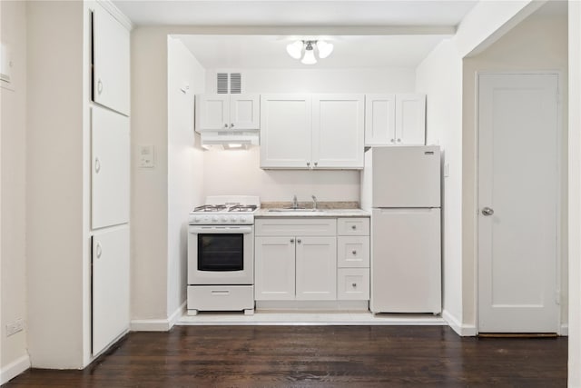 kitchen featuring white cabinetry, white appliances, dark wood-type flooring, and sink