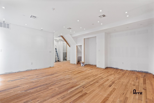 unfurnished room with light hardwood / wood-style floors