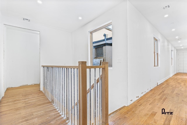 104 Stockton Unit 6, Brooklyn, NY 11206 - hall with light wood finished floors, visible vents, an upstairs landing, and recessed lighting