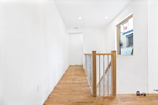 104 Stockton Unit 6, Brooklyn, NY 11206 - hall featuring light wood finished floors, visible vents, and an upstairs landing