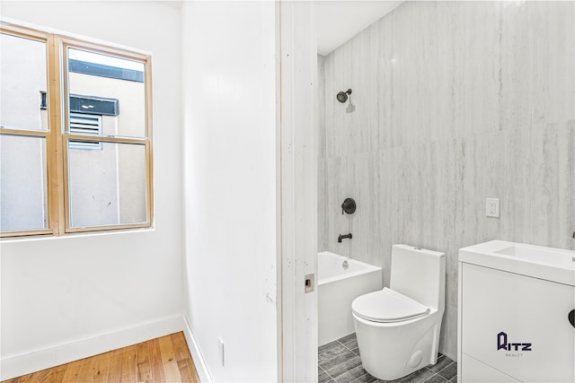104 Stockton Unit 6, Brooklyn, NY 11206 - full bath featuring toilet, a sink, wood finished floors, baseboards, and shower / bathing tub combination