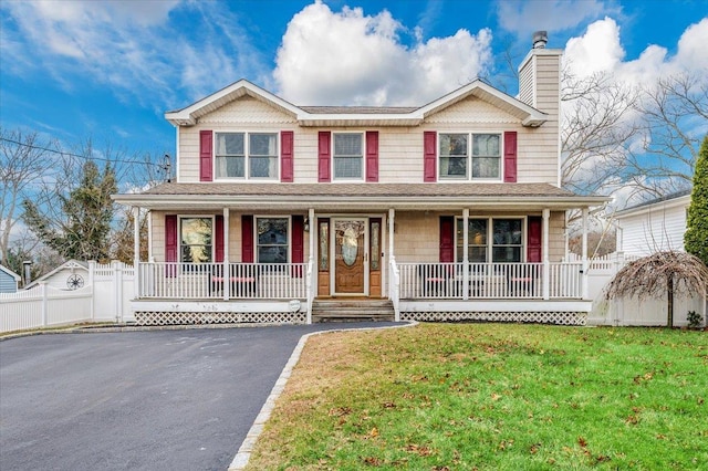 view of front of house with a front lawn and a porch