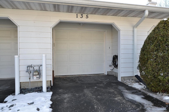 view of snow covered garage