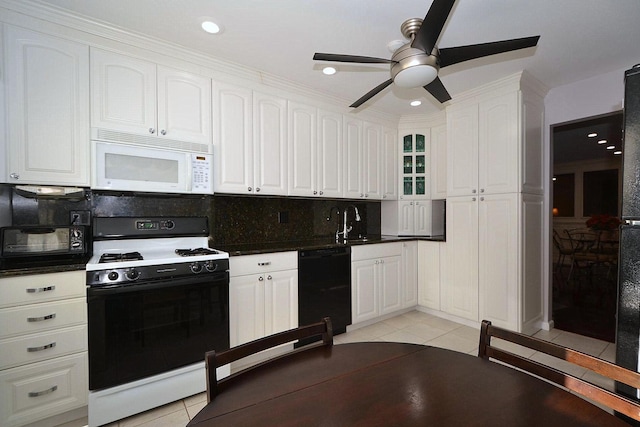 kitchen with white cabinetry, range, black dishwasher, and light tile patterned flooring