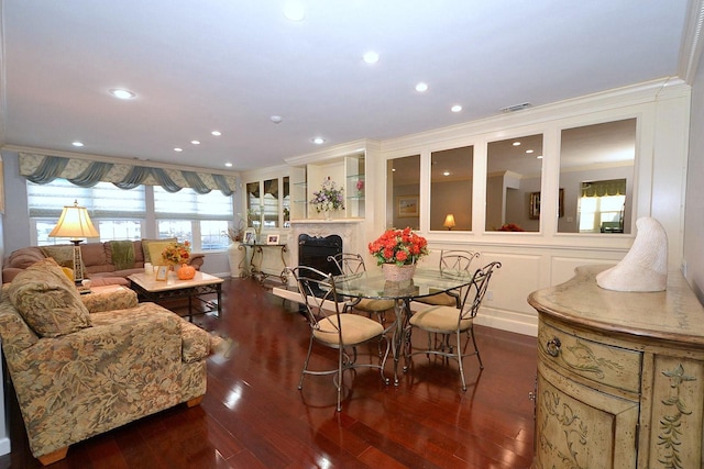 dining room featuring crown molding and dark hardwood / wood-style flooring