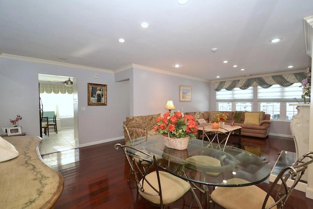 dining area featuring wood-type flooring, ornamental molding, and ceiling fan