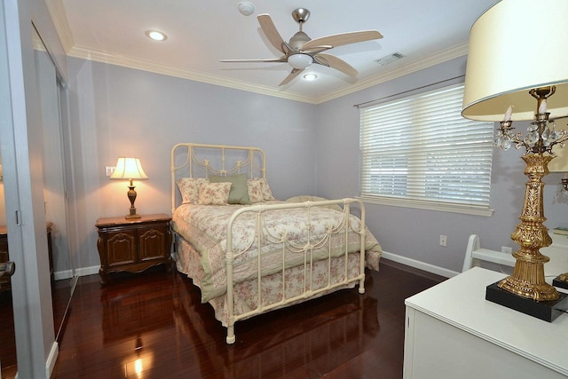 bedroom featuring dark wood-type flooring, ceiling fan, and ornamental molding