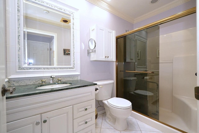 bathroom featuring a shower with shower door, ornamental molding, vanity, toilet, and tile patterned floors