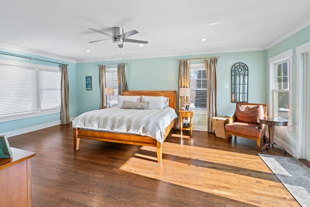 bedroom with dark hardwood / wood-style flooring, multiple windows, and ornamental molding