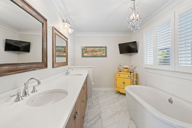 bathroom featuring an inviting chandelier, vanity, a bath, ornamental molding, and toilet