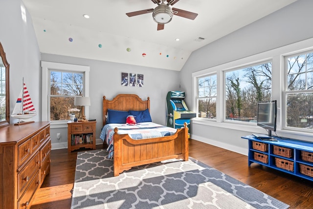 bedroom with dark hardwood / wood-style floors, vaulted ceiling, and multiple windows