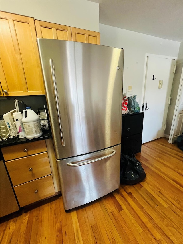 17 Broadway Unit 1K, Harrison, NY 10528 - kitchen featuring stainless steel refrigerator and light hardwood / wood-style floors