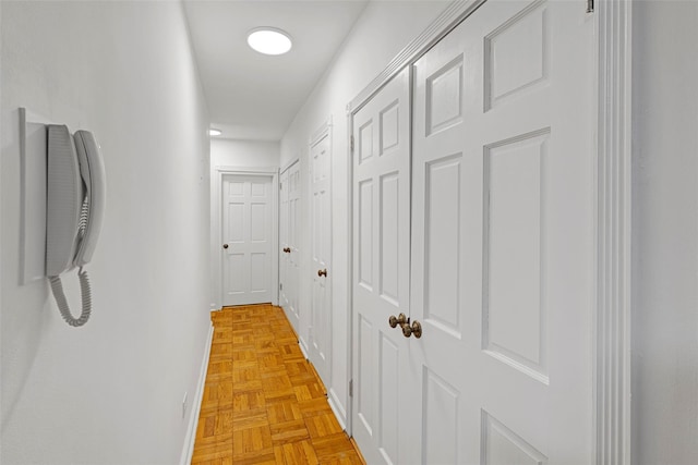 corridor featuring light parquet floors