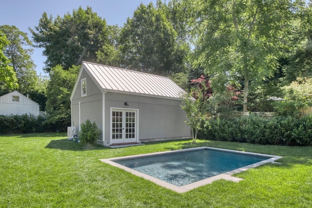 exterior space featuring an outbuilding and a lawn