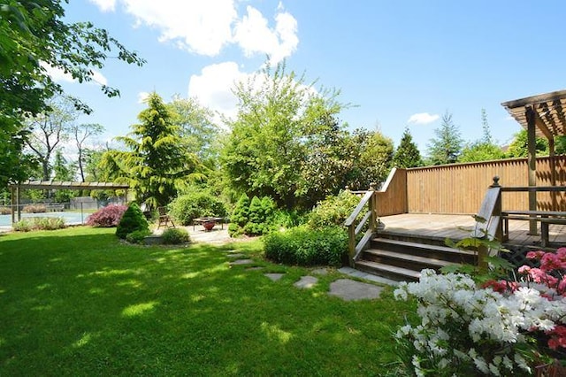 view of yard featuring a wooden deck