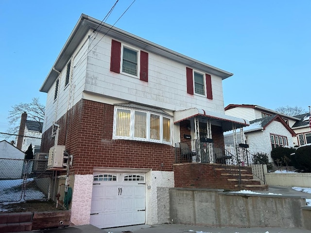 view of front of property featuring a garage and covered porch